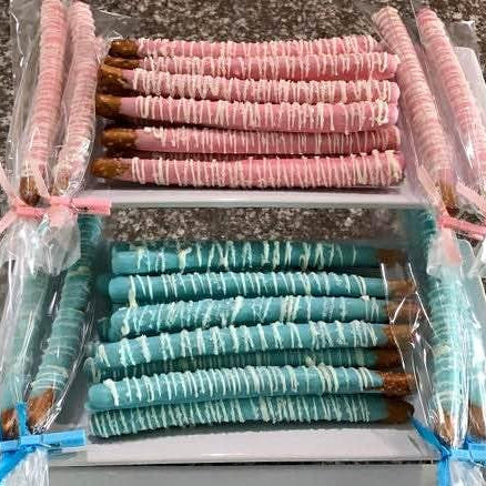 Chocolate-dipped pretzels, gourmet pretzel rods, party favor pretzels, sweet and salty treats, dipped pretzels with drizzle, baby shower pretzels, gender reveal snacks, edible party favors.